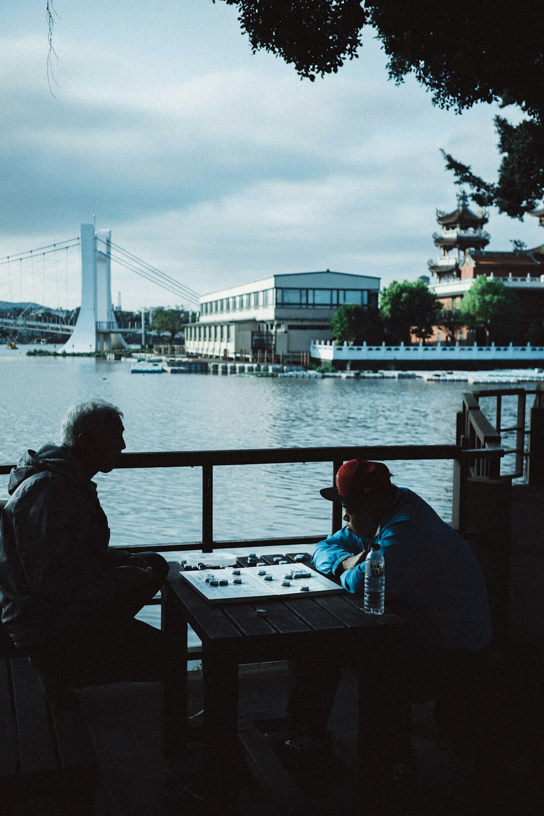 Diverse group of research analysts having a discussion around a table with laptops